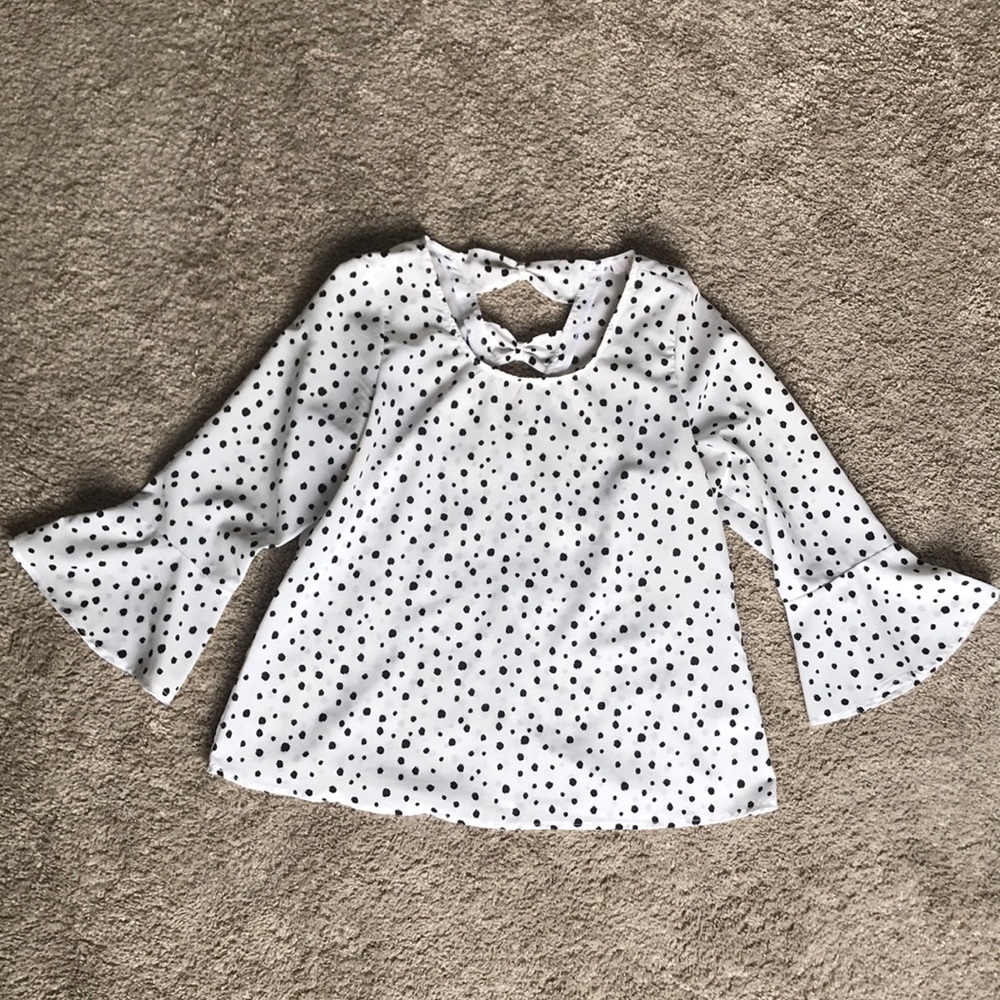 Black and white spotted blouse with bell sleeves